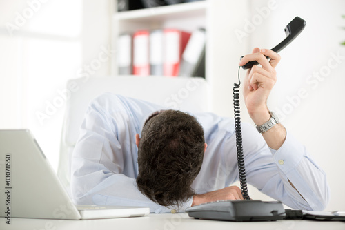 Foto Exhausted Businessman