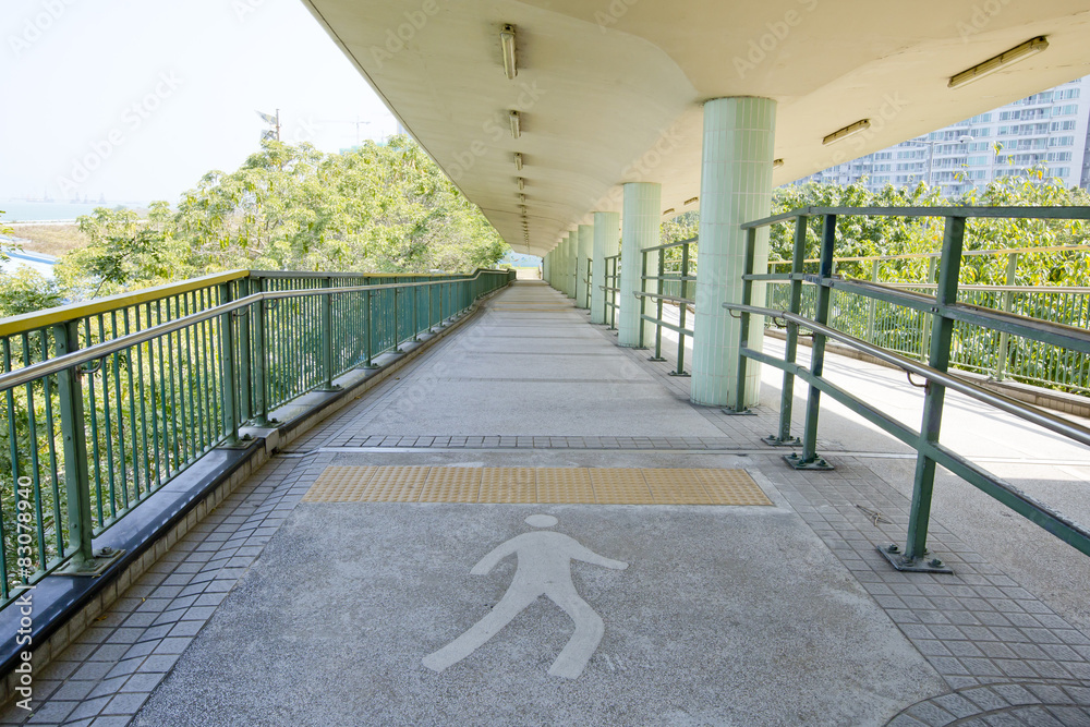 Fototapeta walkway with a metal handrail.