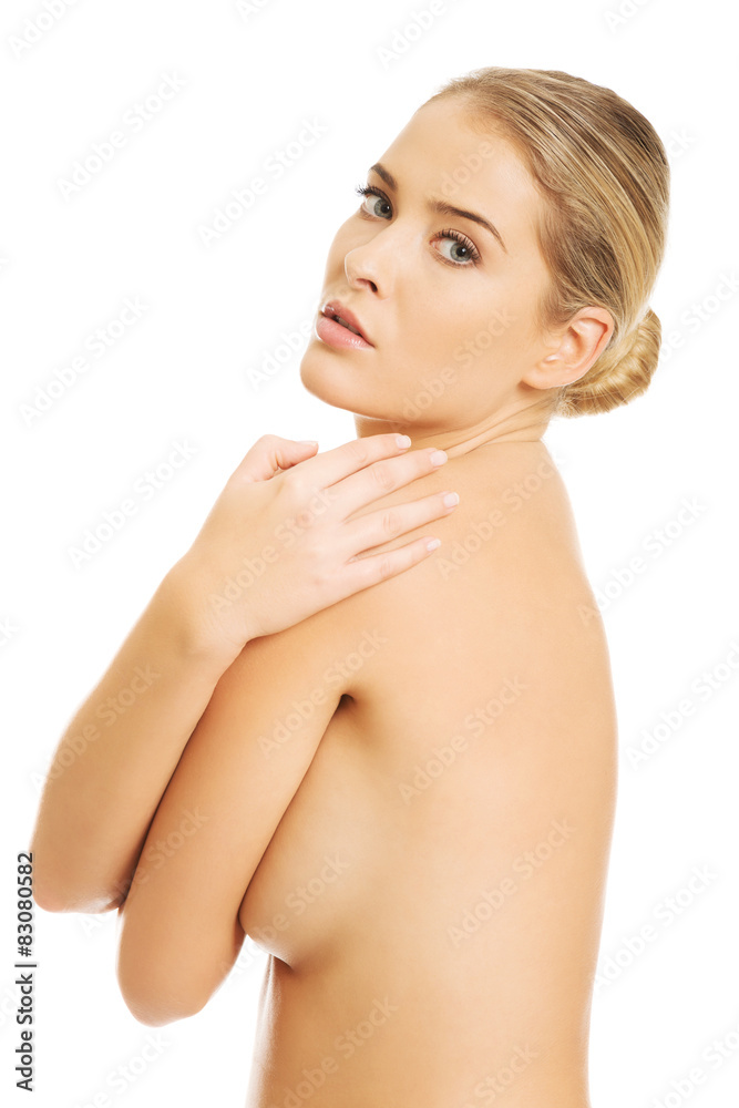 Topless woman covering her breast Stock Photo