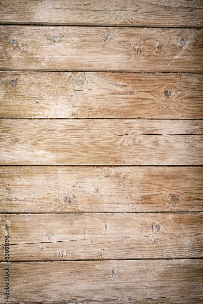 Fototapeta premium Brown textured wooden board background. Vertical.