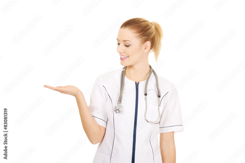 Medical doctor woman with open hand. Medical doctor woman with open hand.