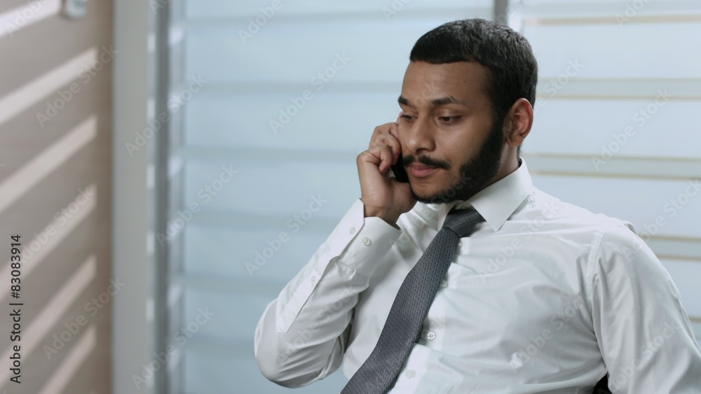Businessman talking on the phone. Businessman talking on the phone.