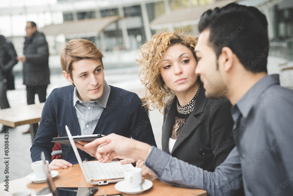 Multiracial business people working outdoor in town Multiracial business people working outdoor in town