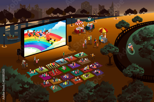 People watching outdoor movie in a park