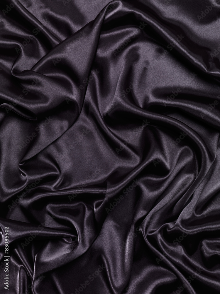 Black shiny silky fabric abstract background