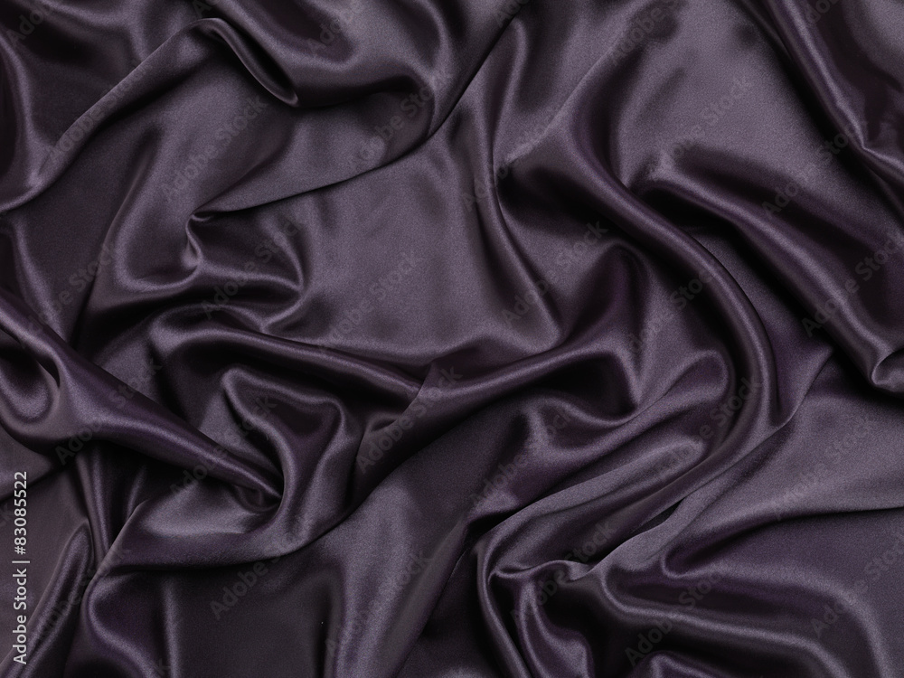 Black shiny silky fabric background