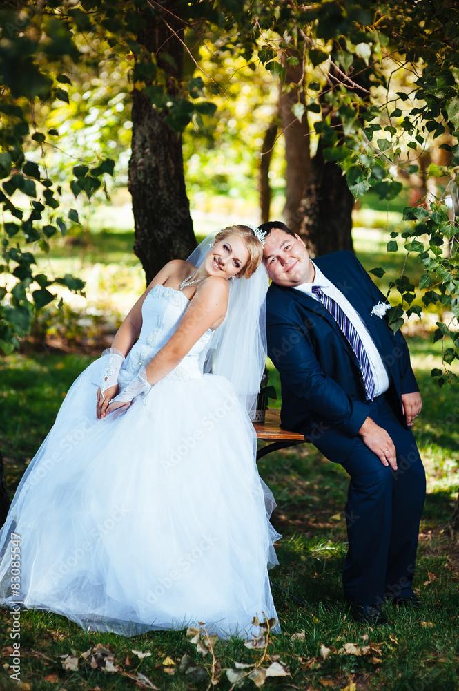 Bride and Groom at wedding Day walking Outdoors on spring nature Bride and Groom at wedding Day walking Outdoors on spring nature