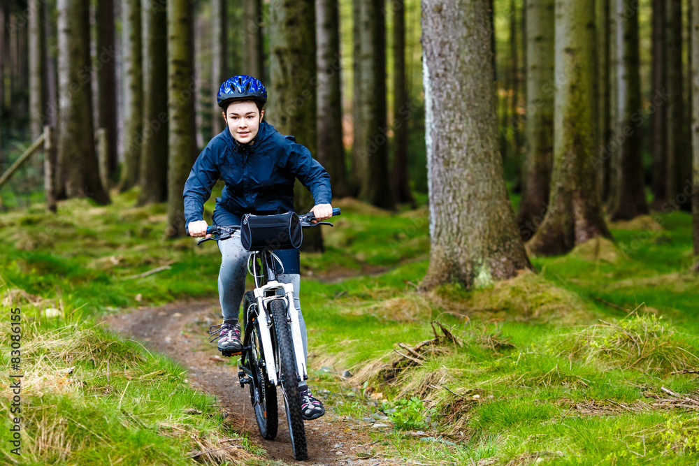 Fototapeta premium Healthy lifestyle - teenage girl biking 
