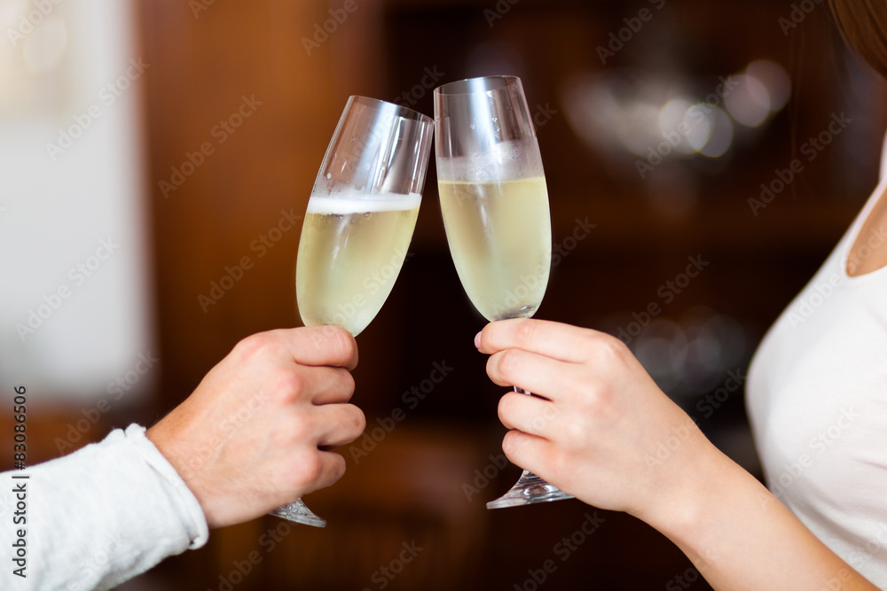 Man and Woman hands toasting with Champagne Man and Woman hands toasting with Champagne