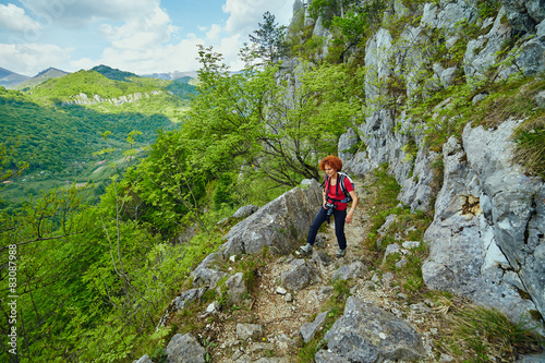 Hiker woman on a mountain trail
