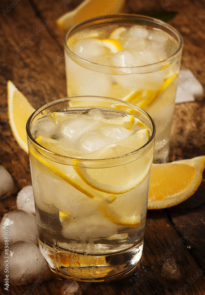 Fresh water with lemon, mint and ice, selective focus Fresh water with lemon, mint and ice, selective focus