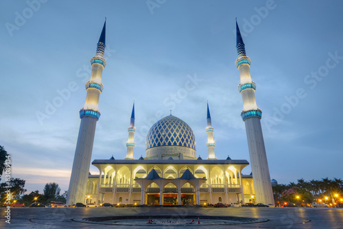 Sunrise at The beautiful Sultan Salahuddin Abdul Aziz Shah Mosque, located at Shah Alam, Selangor, Malaysia. photo