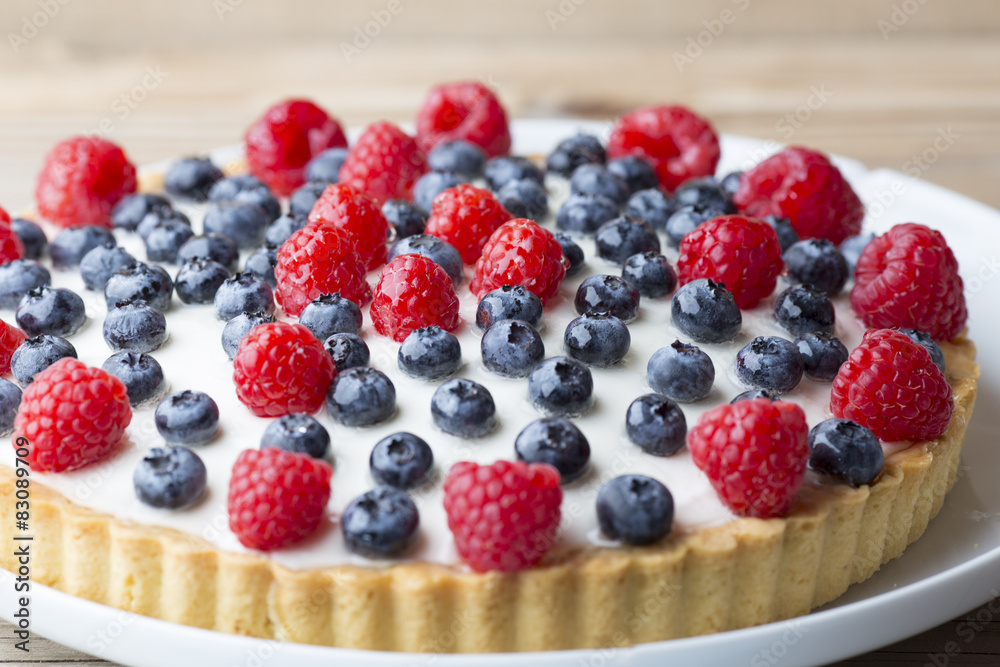 Cake with blueberries and raspberries. Confectionery product. Cake with blueberries and raspberries. Confectionery product.