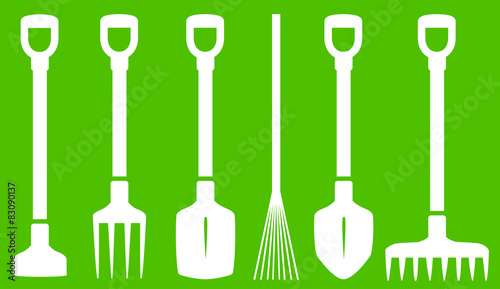 garden tools on green background