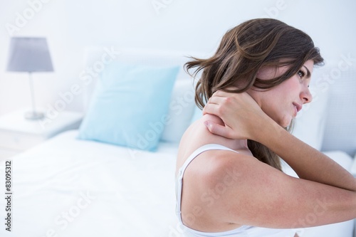 Pretty woman suffering from neck pain  photo
