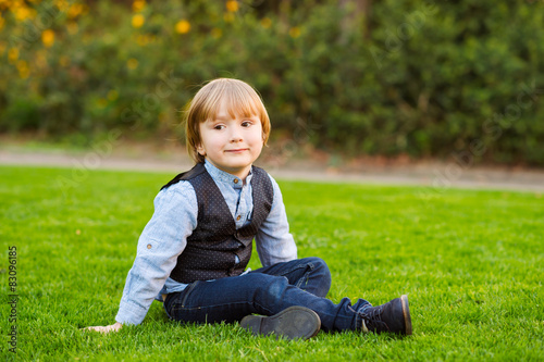 Outdoor portrait of adorable little boy 