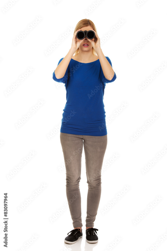 Young woman with binoculars. Young woman with binoculars.