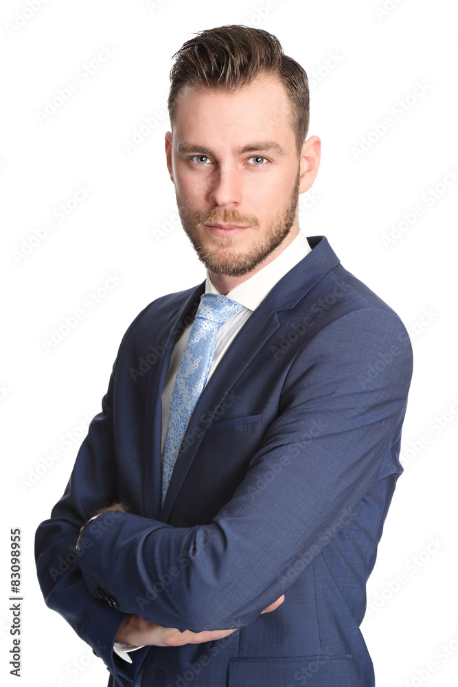 An attractive businessman wearing a blue suit and tie An attractive businessman wearing a blue suit and tie