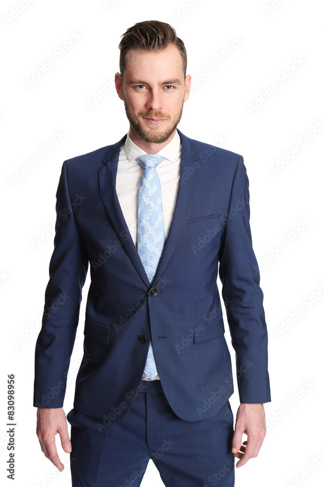 An attractive businessman wearing a blue suit and tie An attractive businessman wearing a blue suit and tie