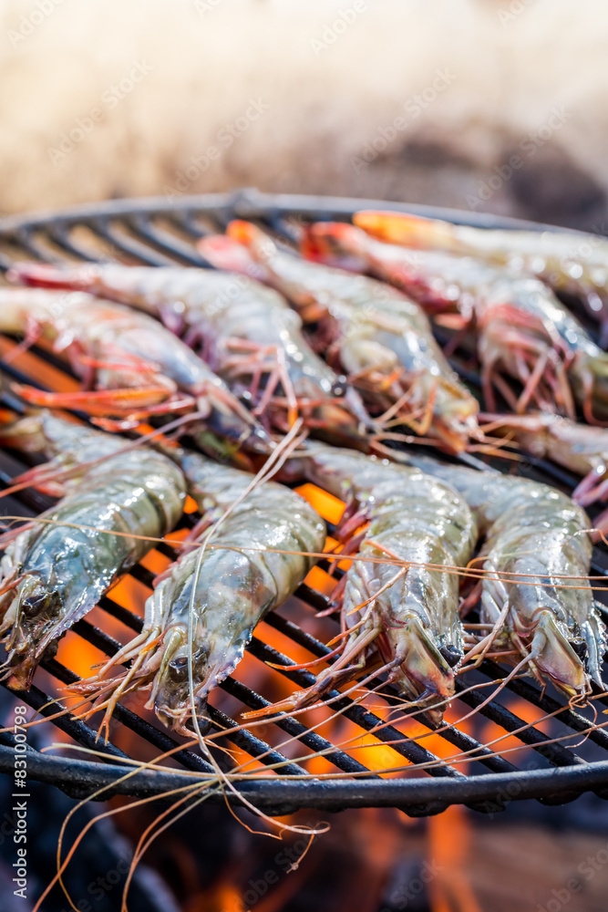 Grilling fresh prawns with lemon and parsley Grilling fresh prawns with lemon and parsley