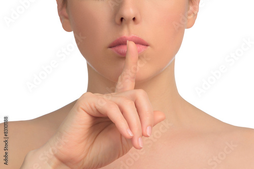 Image with woman's face shows gesture of silent