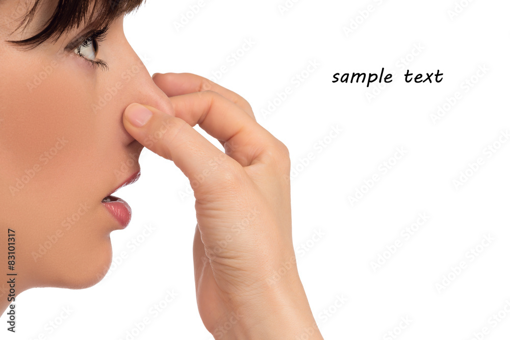 Fototapeta premium Image with woman's face holding her nose with hand