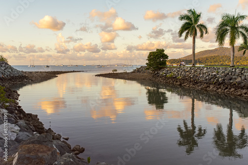 Tropical sunset over a small river which flows into the sea