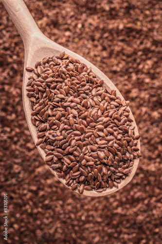 Flax seeds linseed on wooden spoon