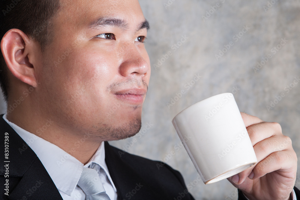 close up face of business man and ceramic coffee cup in hand wit close up face of business man and ceramic coffee cup in hand wit