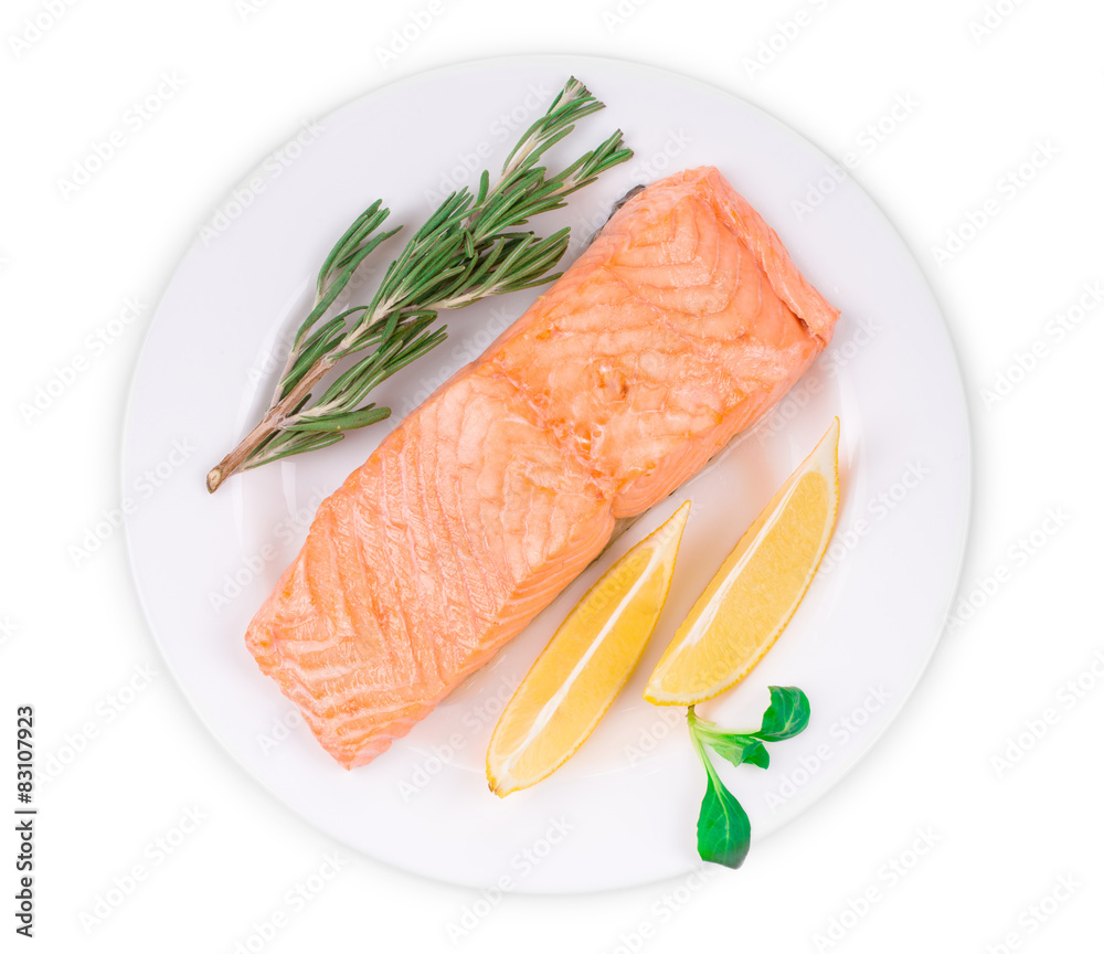 Fried salmon fillet on plate with lemon. Fried salmon fillet on plate with lemon.