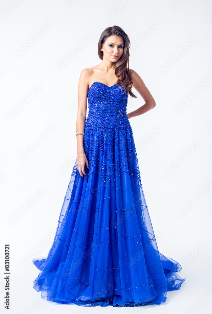 Young woman in a beautiful blue evening dress