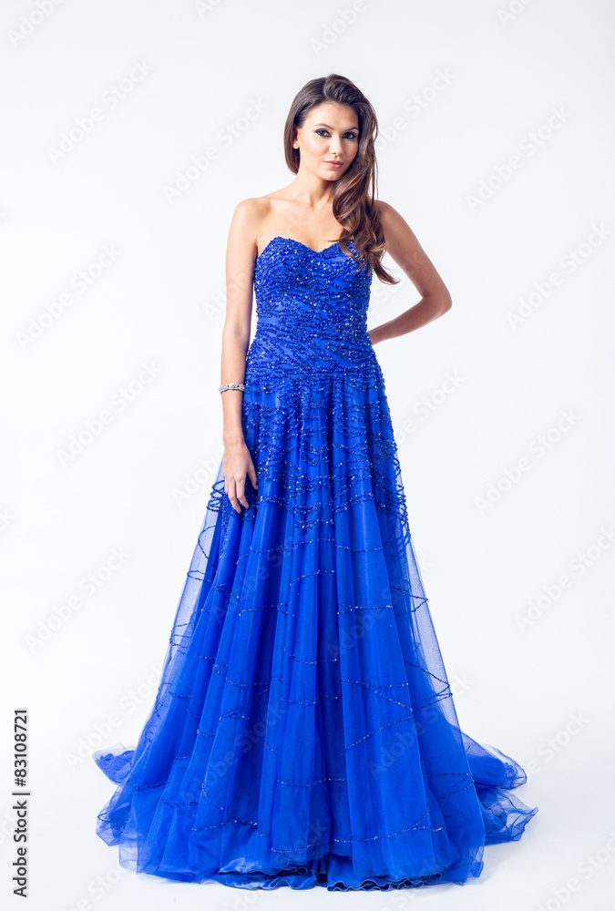 Young woman in a beautiful blue evening dress Young woman in a beautiful blue evening dress