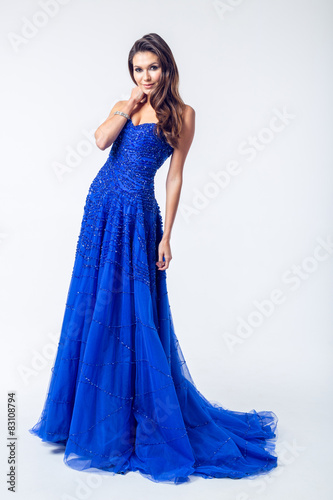 Young woman in a beautiful blue evening dress