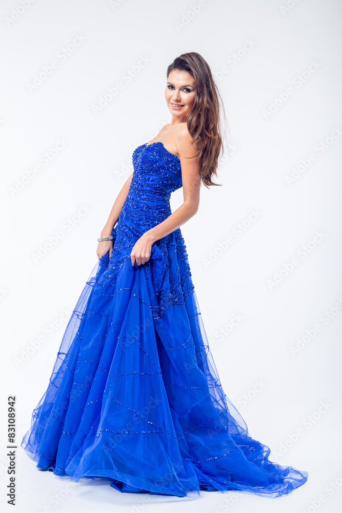 Young woman in a beautiful blue evening dress Young woman in a beautiful blue evening dress