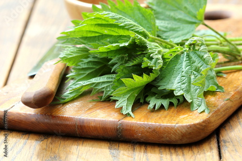 stinging nettle on a cutting board photo