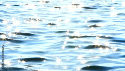 glittering light blue sea water ripples from the sunlight