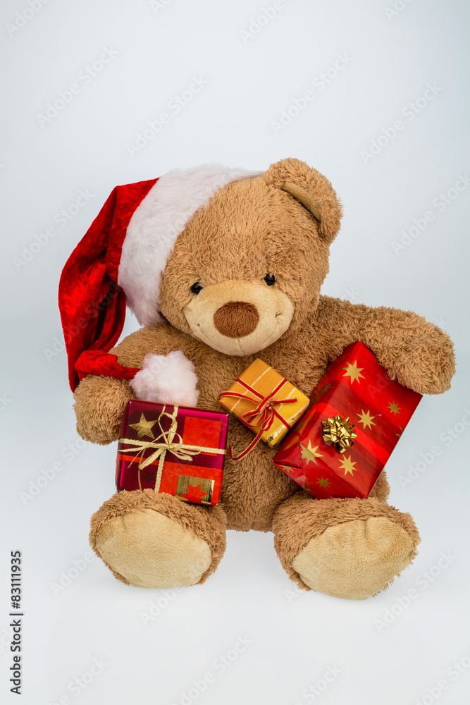 Teddybär mit Weihnachtsgeschenken Teddybär mit Weihnachtsgeschenken