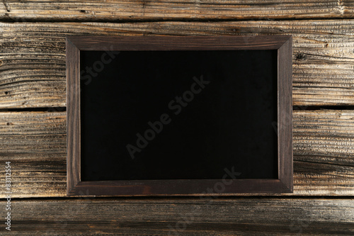Wood frame on brown wooden background