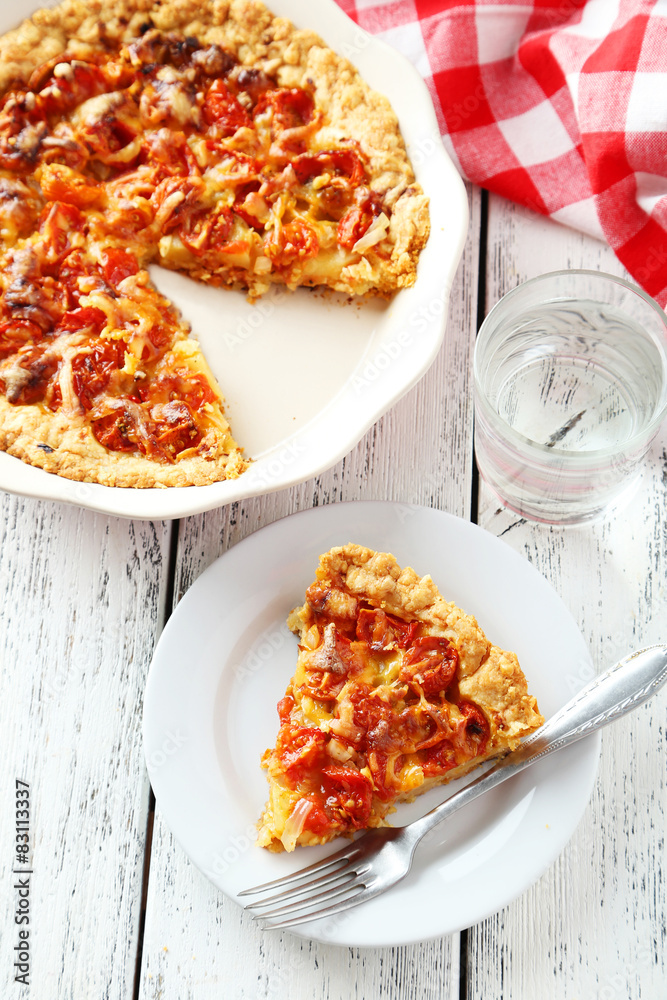 Fresh tomato pie on white wooden background Fresh tomato pie on white wooden background