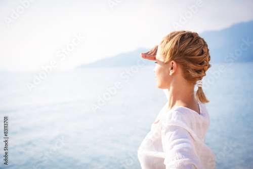 Portrait of a young woman looking over horizon © Zoran Zeremski