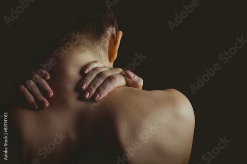 Nude woman with a neck injury