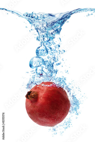 pomegranate splashing in water