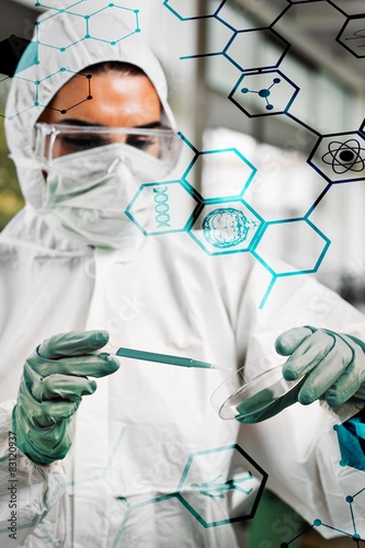 protected female science student dropping blue liquid  photo