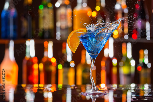 Martini drink served on bar counter photo