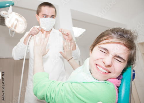 Young patient scared of a dentist