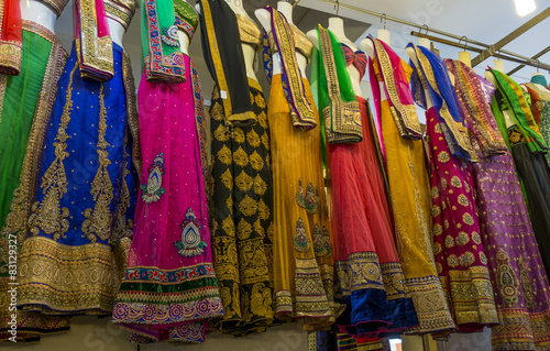 Racks of colourful Indian sari's for sale in a Indian marker © parkerspics