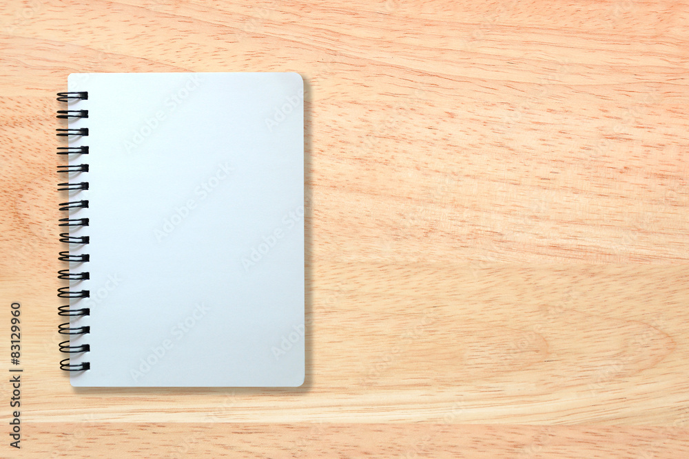 white page of notebook on wood texture white page of notebook on wood texture