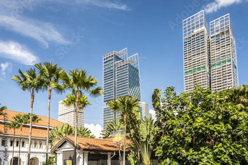 Modern glass sky scrapers, next to low rise colonial buildings in Singapore