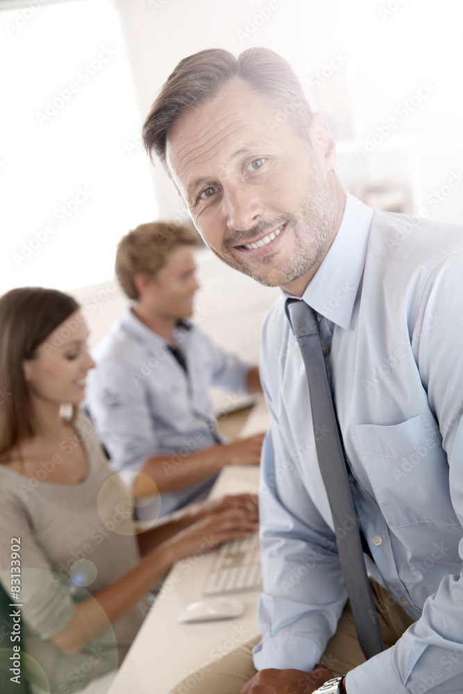 Fototapeta premium Business manager with employees in background