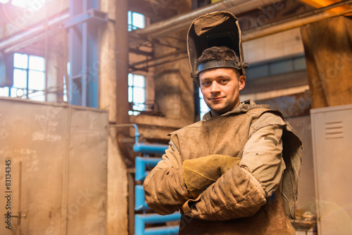 Young man with protective mask in a welding factory © Halfpoint